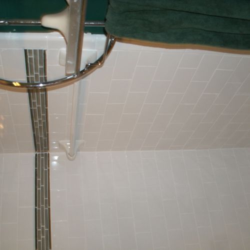 Tiled bath tub and shower surround