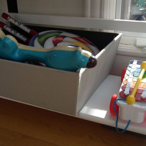 Easy access to musical toys for two children ages 