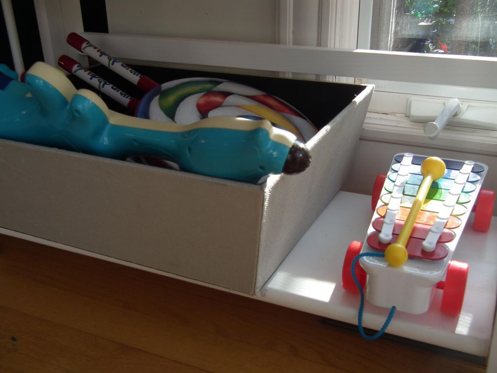 Easy access to musical toys for two children ages 