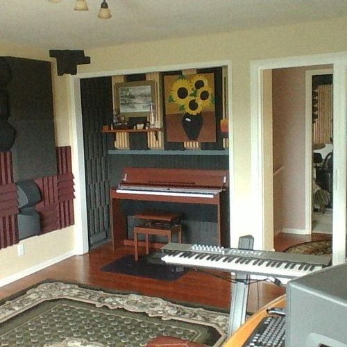 Console room with Roland DP990 piano and Novation 
