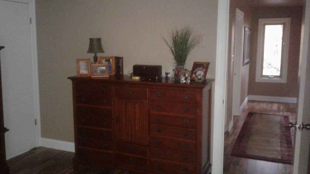 Replaced trim, installed Acacia hardwood flooring 