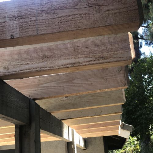 New ceiling joists installed on an exterior patio.