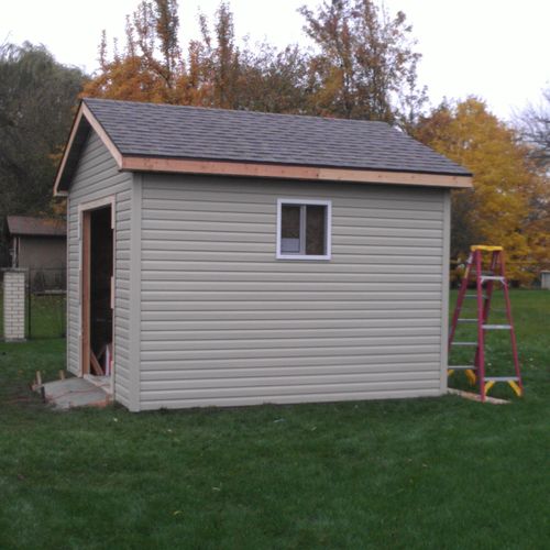 12 x 12 shed, concrete, framing, siding, roof and 