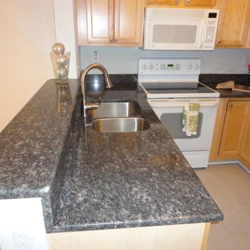 New custom granite counter top and sink with fixtu