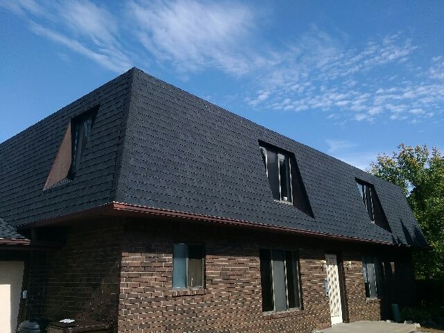 Large Asphalt Shingle Roof Of Apartment Building.