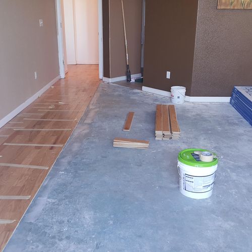 Engineered glue down hardwood floor install.