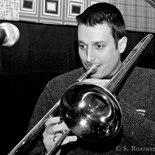 Demonstrating technique on the trombone.