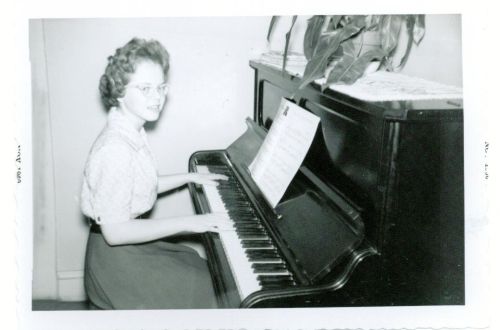 Gloria Huffman, age 13, practicing piano in 1960.