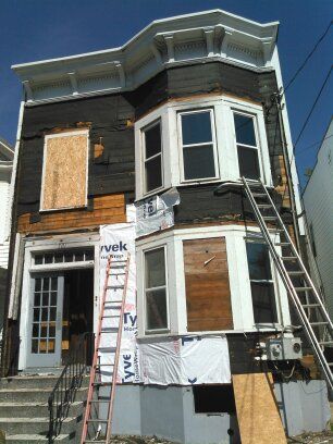 All of the old wood siding down and start to prepa