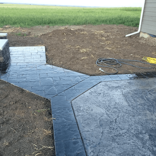 Colored Patio/Firepit. Tile border with slate inte