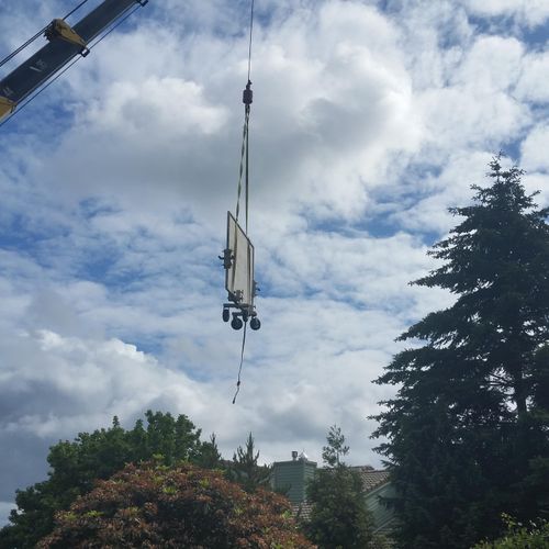 Using a crane to deliver/install an island top.