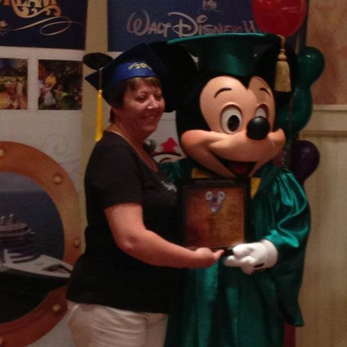 Mickey Mouse came in cap and gown to give all trav