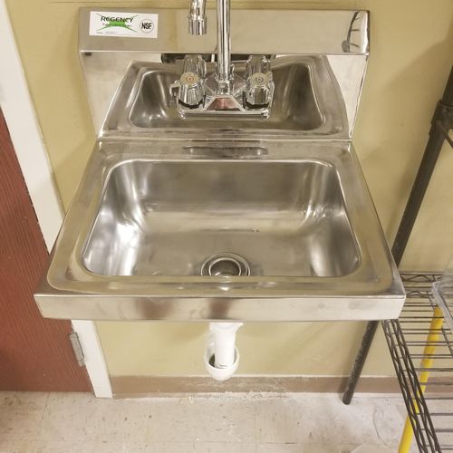installed plumbing and sink for a handwashing stat