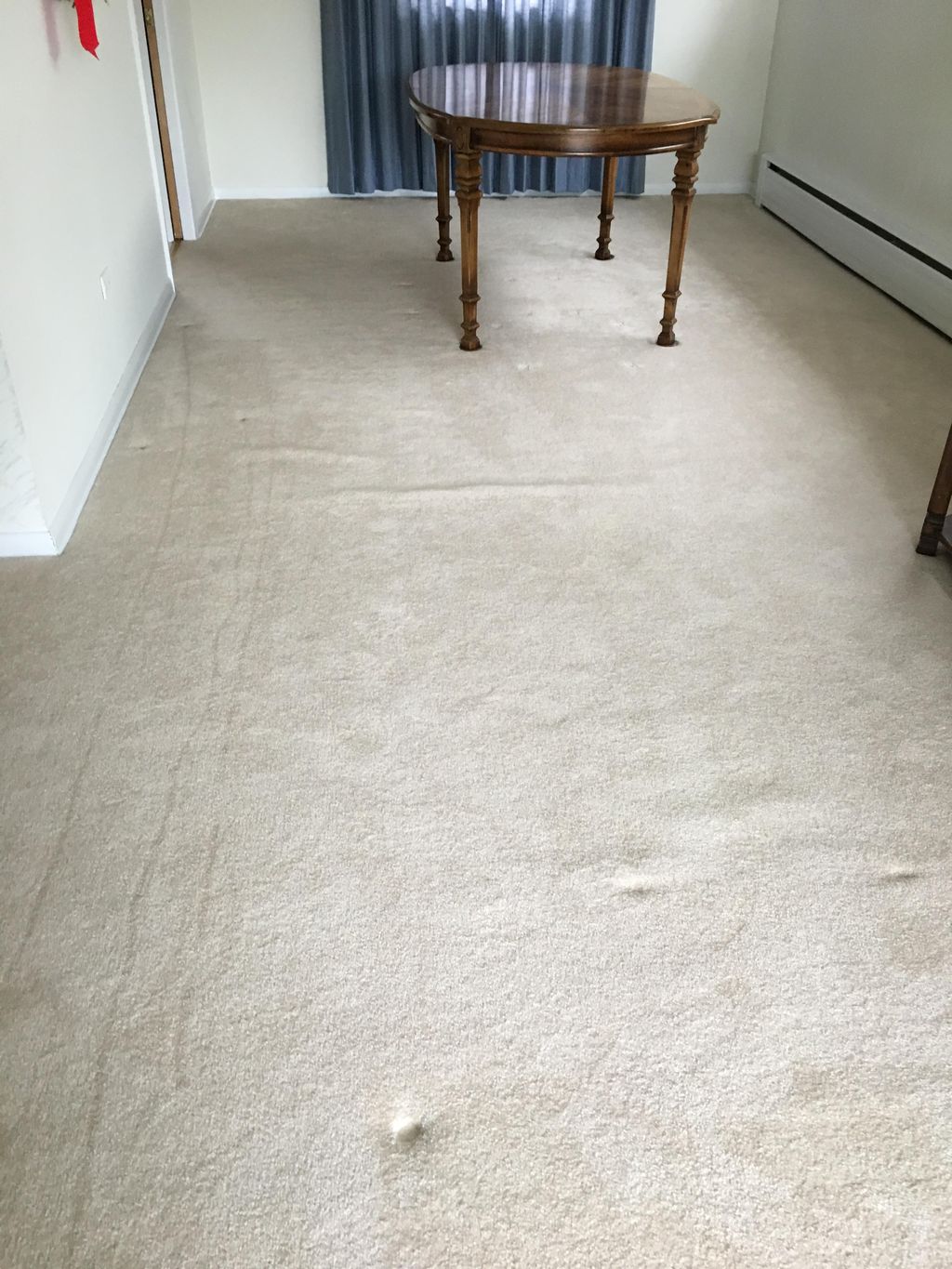 Re-stretch living room carpet before