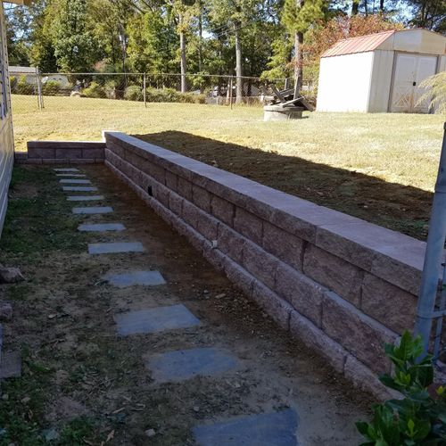 Small segmental retaining wall that replaced a woo