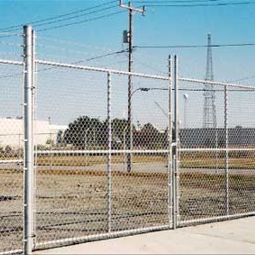 commerical gates with barbedwire
