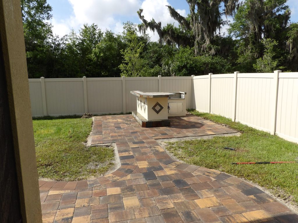 Small paver patio with outdoor kitchen.