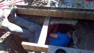 Working under a patio to do a sewer repair