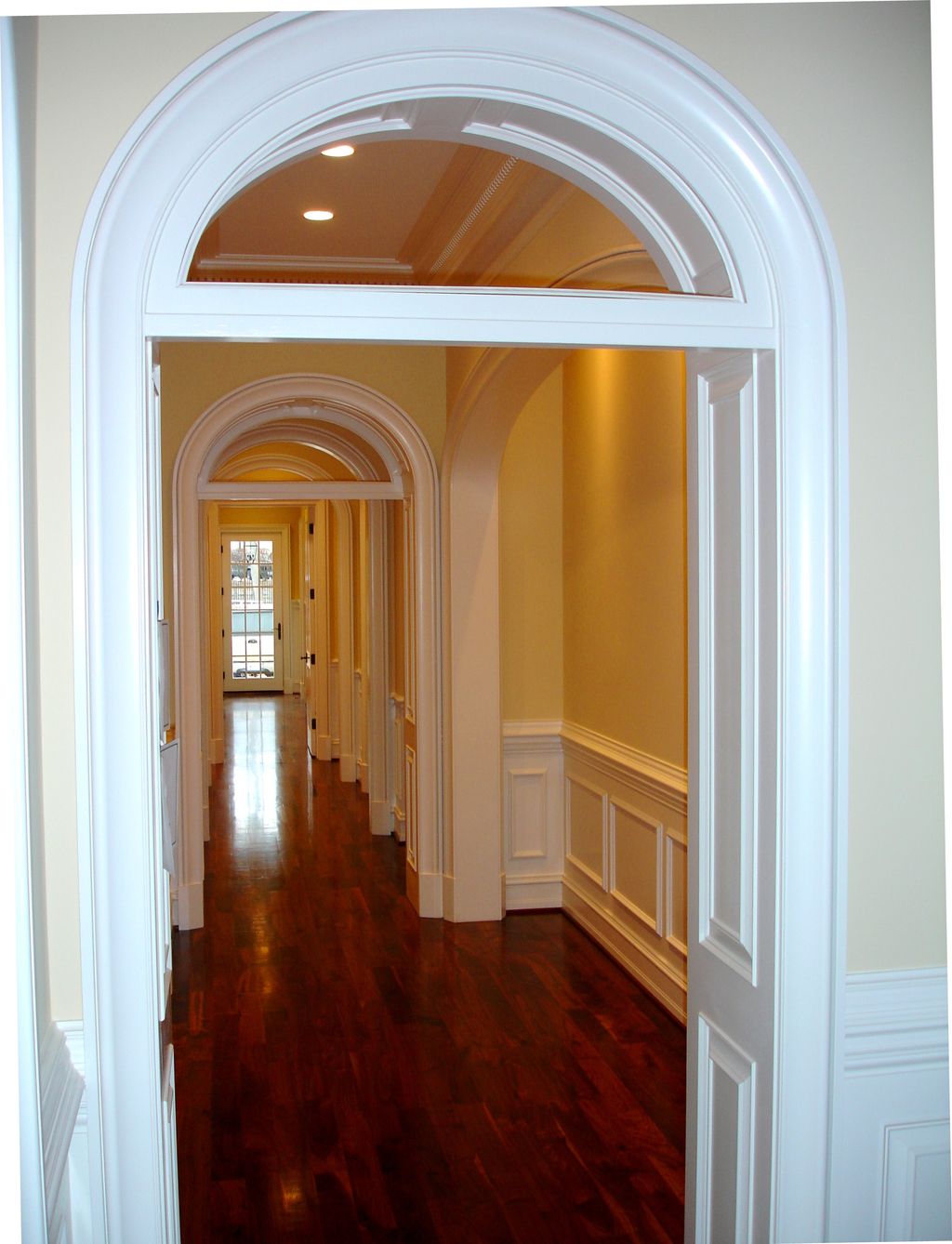 Wainscoting, paneled jambs, custom archways