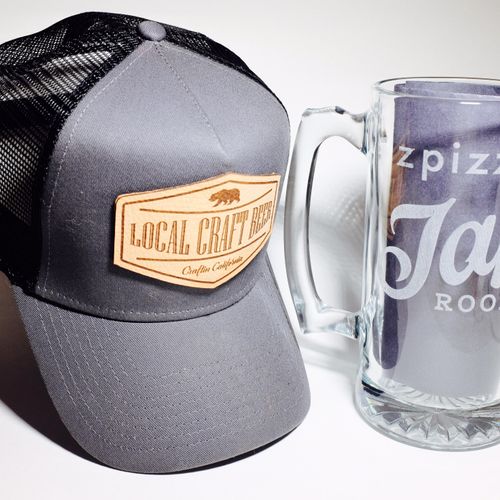 A nice hat from our apparel line with a custom mug