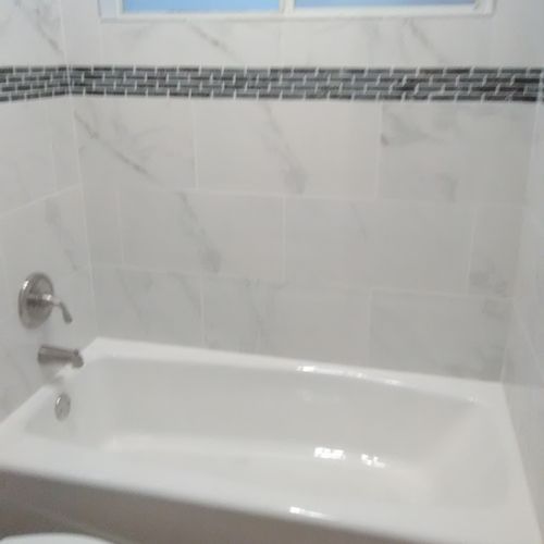 Installed tub and shower surround, 