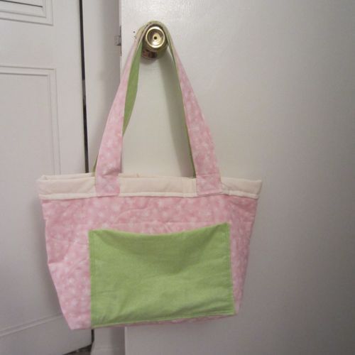 pink and green diaper bag