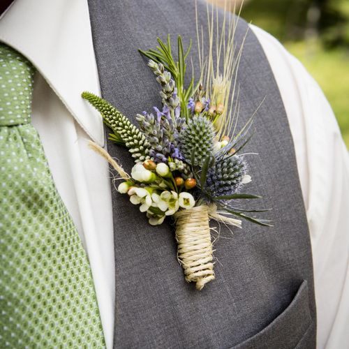 Boutonniere with lavender, wheat, and thistle