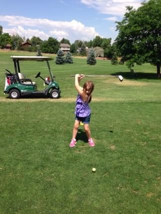 Girl student at the top of her swing into transiti