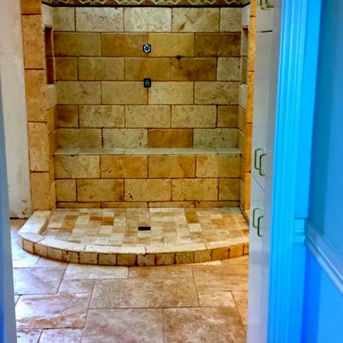 Travertine shower and Main floor done in french pa