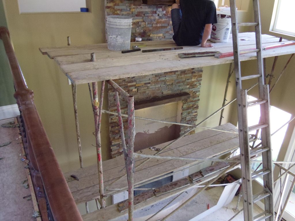Stone fireplace with ledges and lighting