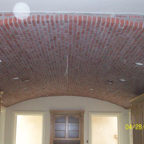 Brick facing on the ceiling of this kitchen. Of co