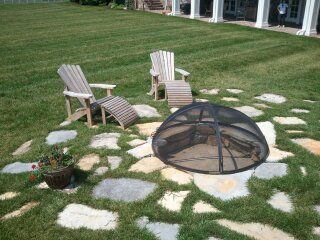 Fire Pit using stone from the clients property. Cu