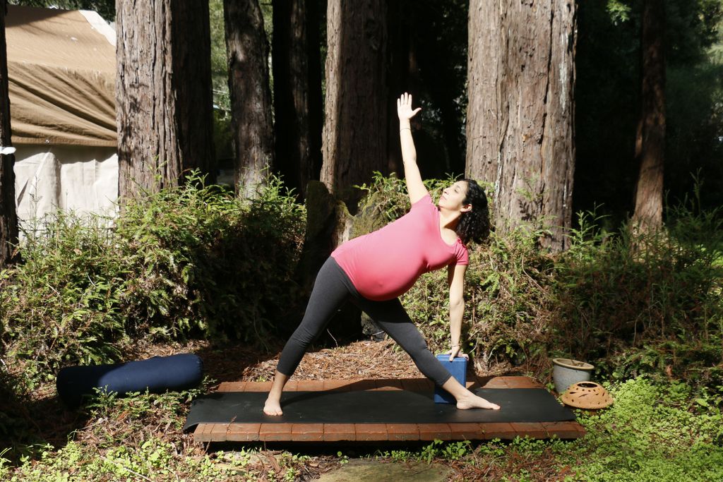 Instructor, Sonya Padron holding trikonasana durin