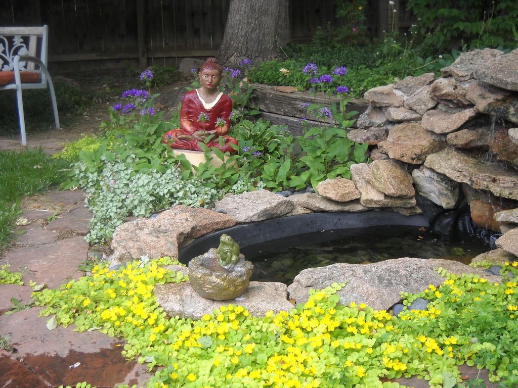 Painted Budha and waterfall