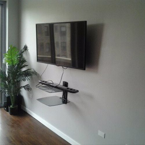 Tv mounting with shelf.