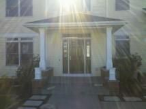 Front porch remodel with pillars and flower boxes
