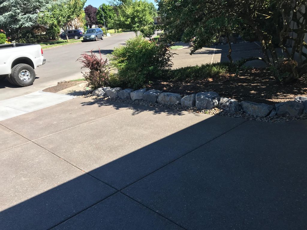 Colored Exposed Aggregate Concrete with wall rock 