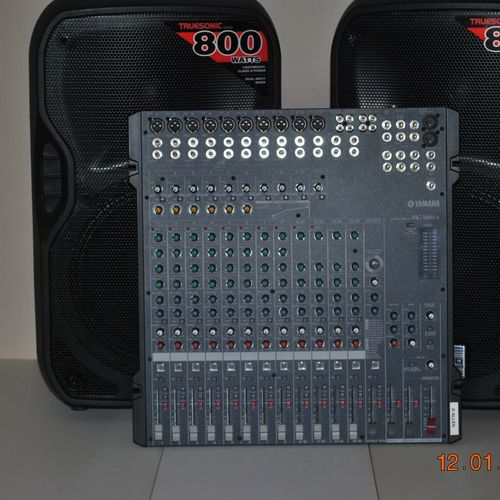 This is a Yamaha MG166CX mixing console. 16 input 