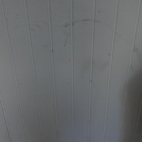 Marked up wall before cleaning