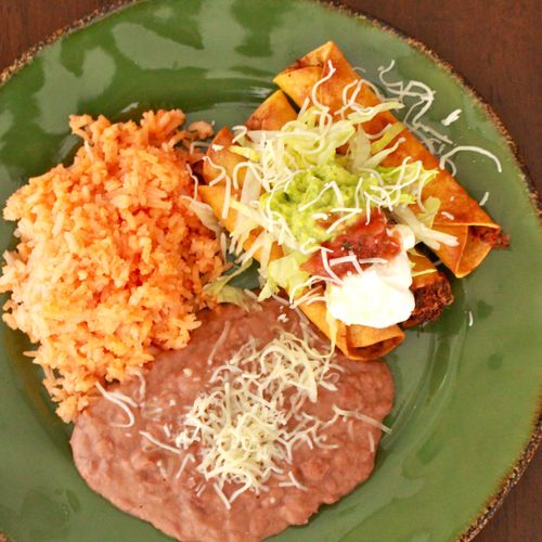 Marinated Shredded Beef Taquitos with rice and bea