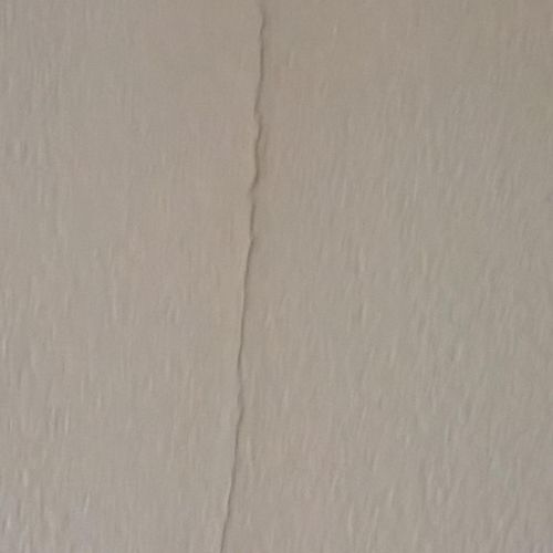 Drywall crack above arch doorway