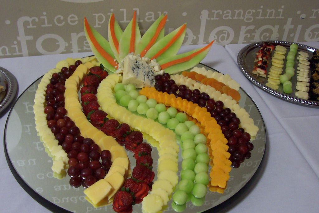 A fresh fruit and cheese tray.