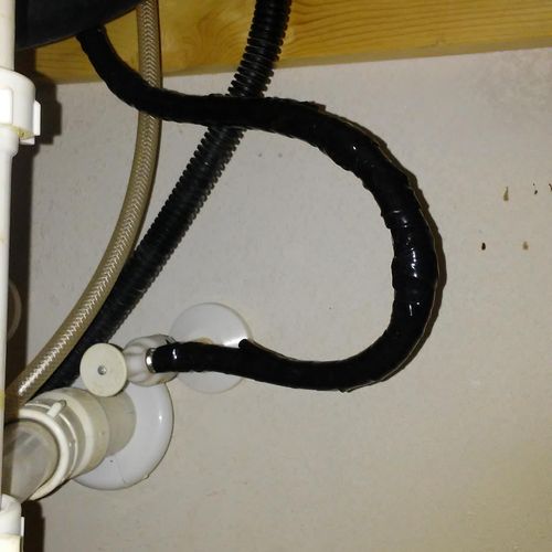 leaky supply line under kitchen sink