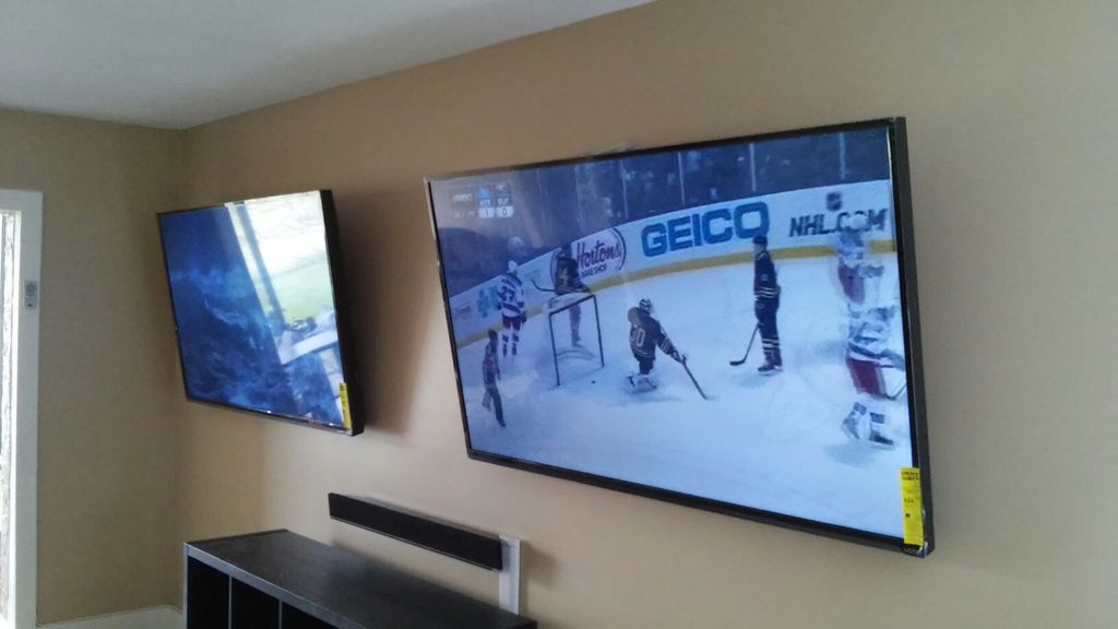 sports fan likes his 2 tv's also both hooked to so