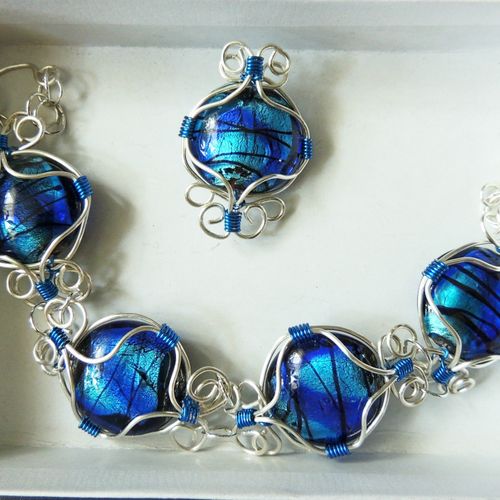 Wrapped blue glass Pendant and bracelet in silver.