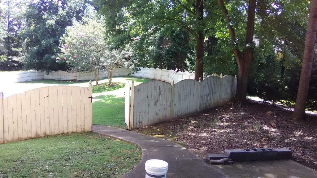 A before picture of a fence we started pressure wa
