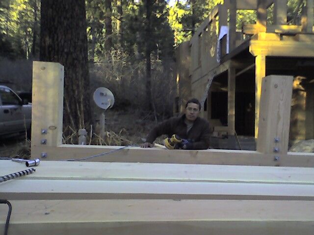 Hands on in building.  Exposed supporting beams fo