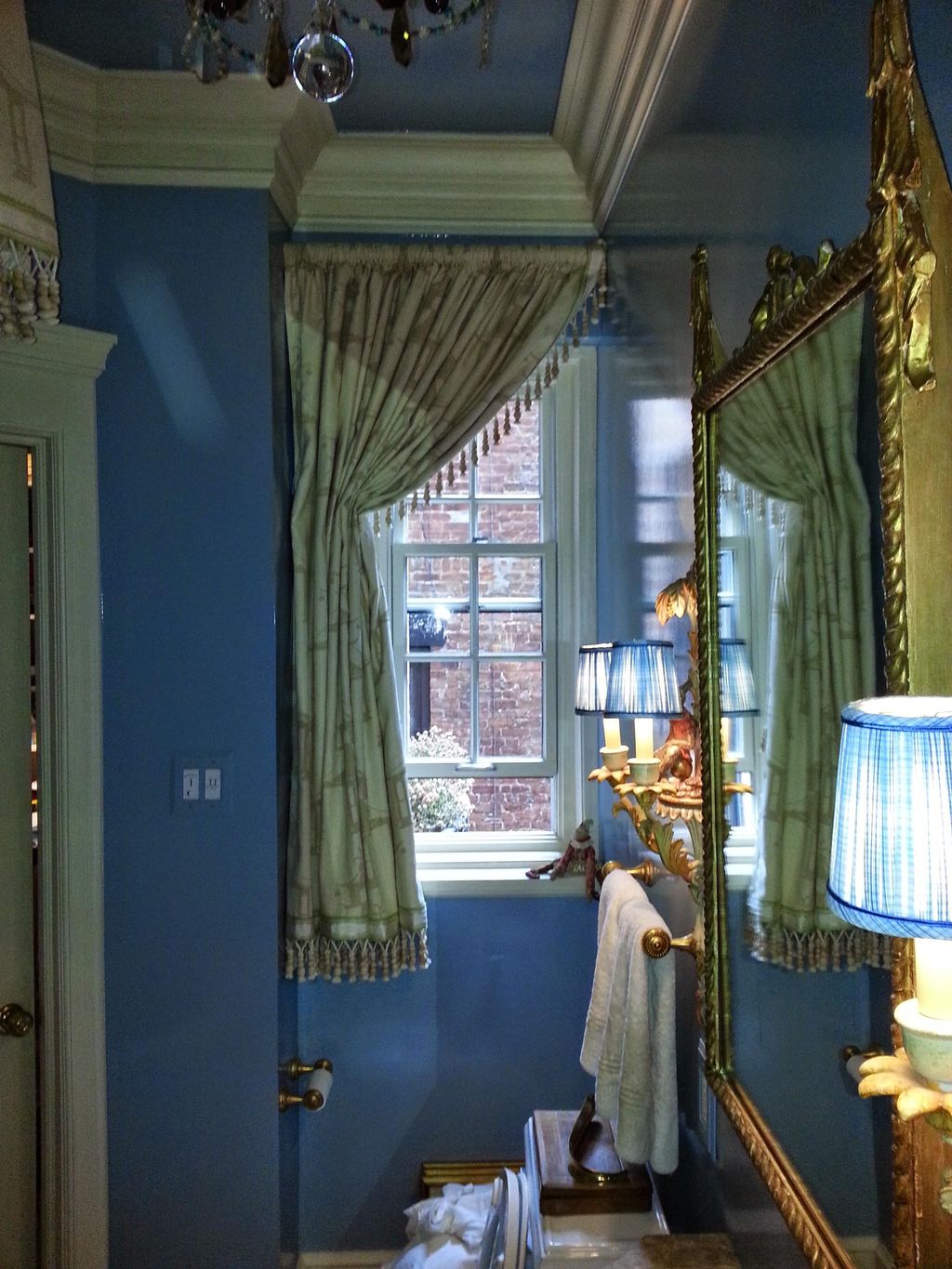 Custom made curtain installed over bathroom window