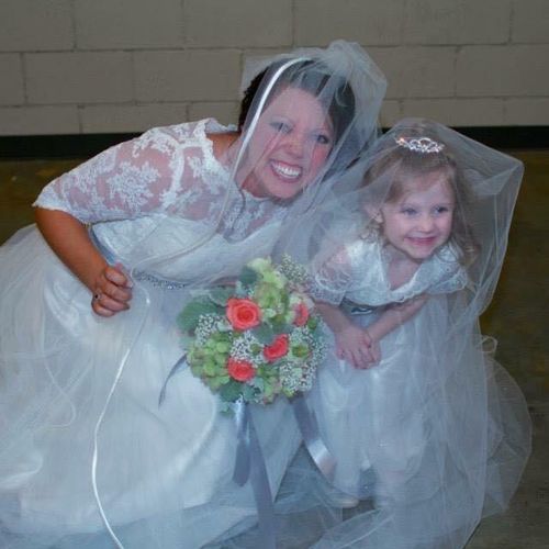 Bride with her adorable flower girl