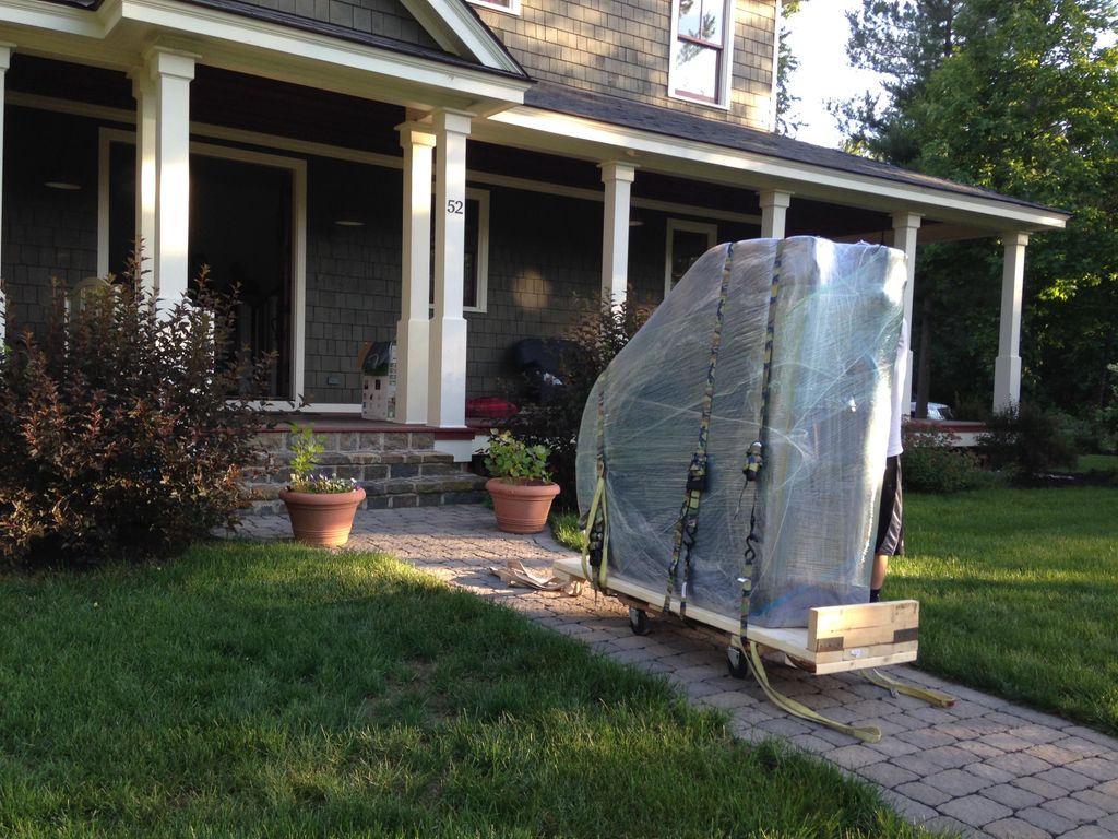 Baby grand being carefully delivered.